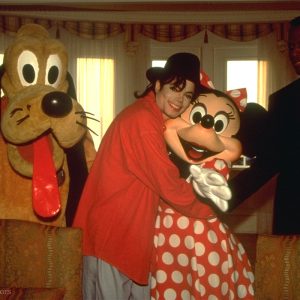 Michael Jackson and Sidney Poitier at Disneyland with Minnie Mouse and Pluto.