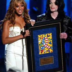 Beyoncé presents the Humanitarian Award to Michael Jackson at the 2003 Radio Music Awards held at the Aladdin Hotel and Casino in Las Vegas, Nevada, on October 27, 2003.