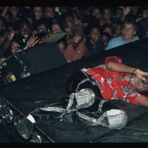 Michael Jackson singing while lying on stage in the 1980s.