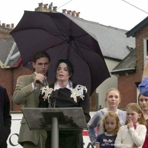 Michael Jackson with David Blaine and Uri Geller attends a fundraising event in the UK for Children with AIDS and Support for Africa in 2002.