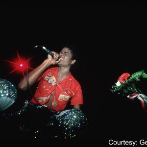 Michael Jackson singing on stage during the Jacksons' Triumph Tour in 1981.