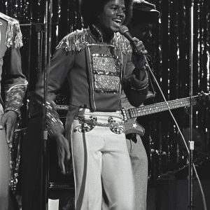 Michael Jackson performs on stage with The Jacksons